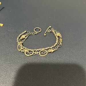 Island cowgirl 3 strand bracelet with toggle clasp. Two toned